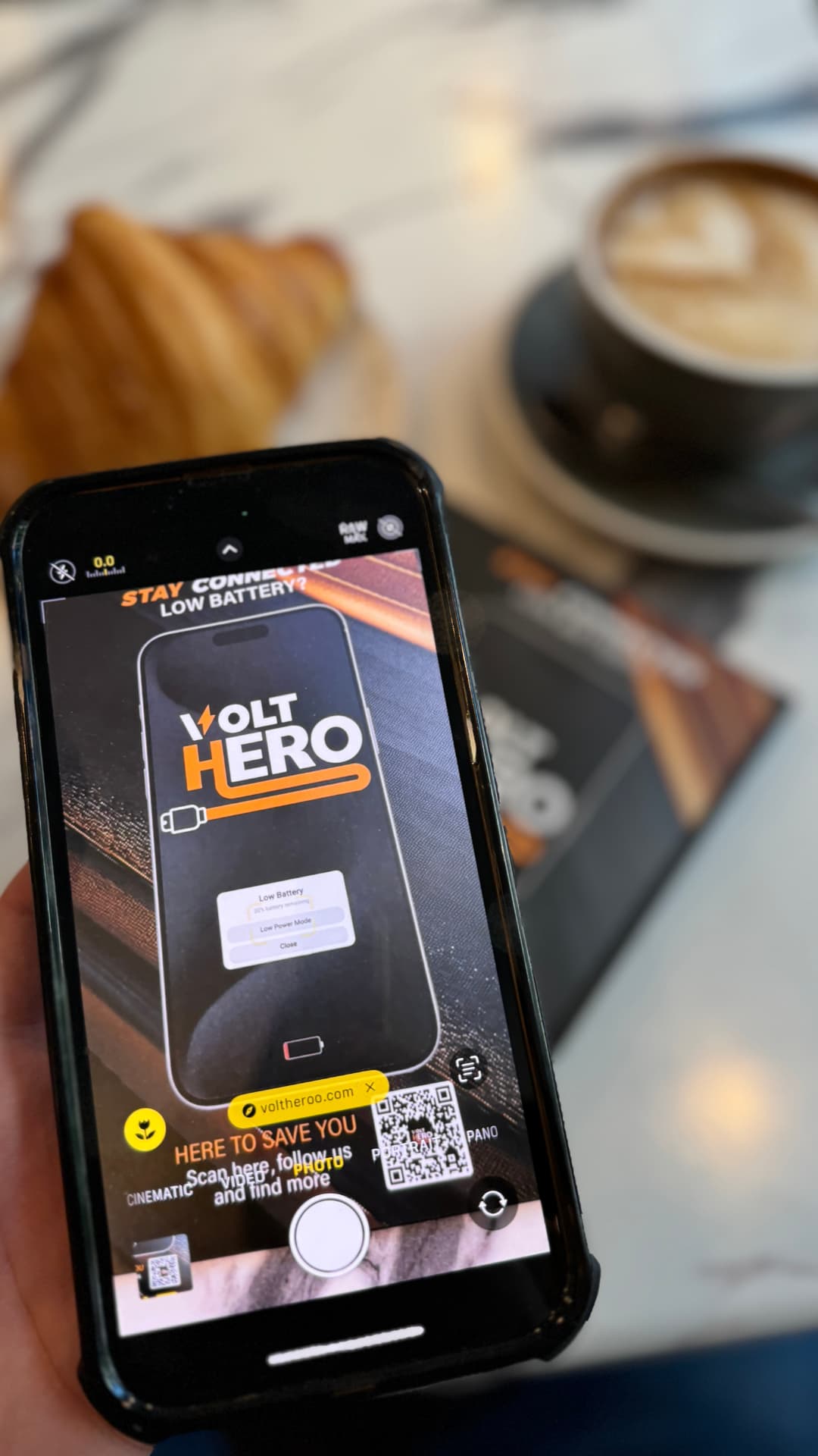 Customer scanning the VOLT HERO QR code with a phone